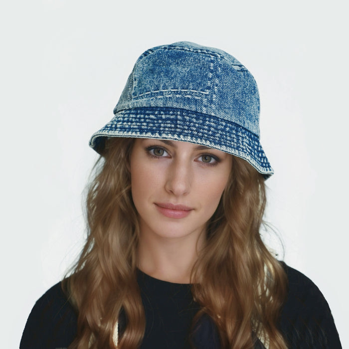 Woman wearing a wide-brim blue denim patchwork bucket hat, perfect for stylish summer sun protection.