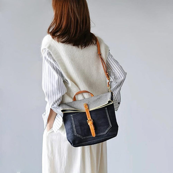Model carrying a  Denim Trimmed Messenger Bag as crossbody, easy for commuting and weekends.