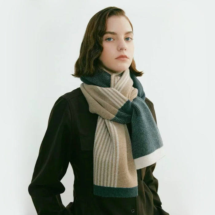 Model wearing soft striped scarf in beige, dark green, and white, made of polyester and acrylic.