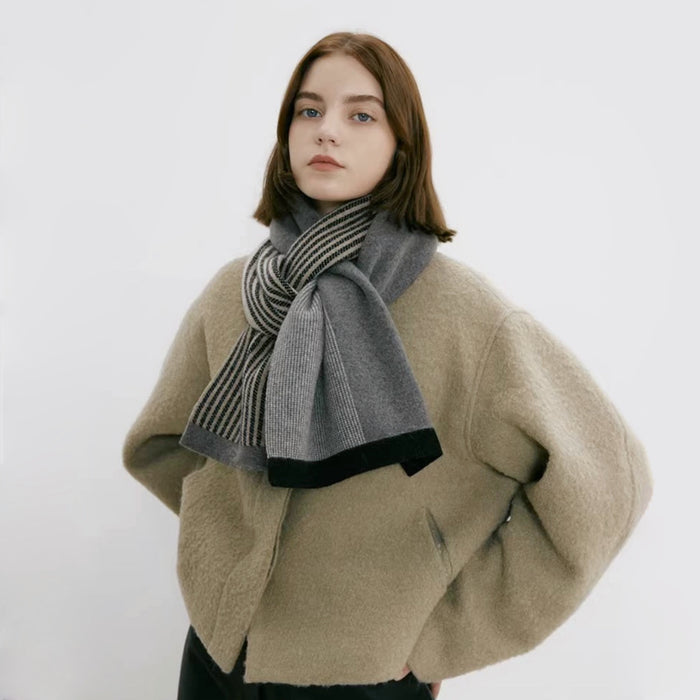 Model wearing a striped scarf in beige and gray, ideal for daily wear and travel.