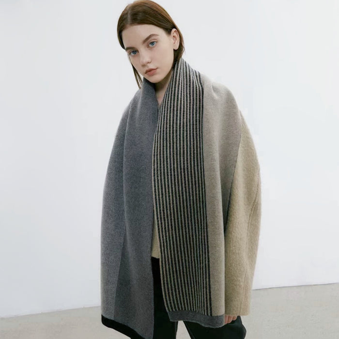 Model wearing a striped scarf in beige and gray, great for office layering and commuting.