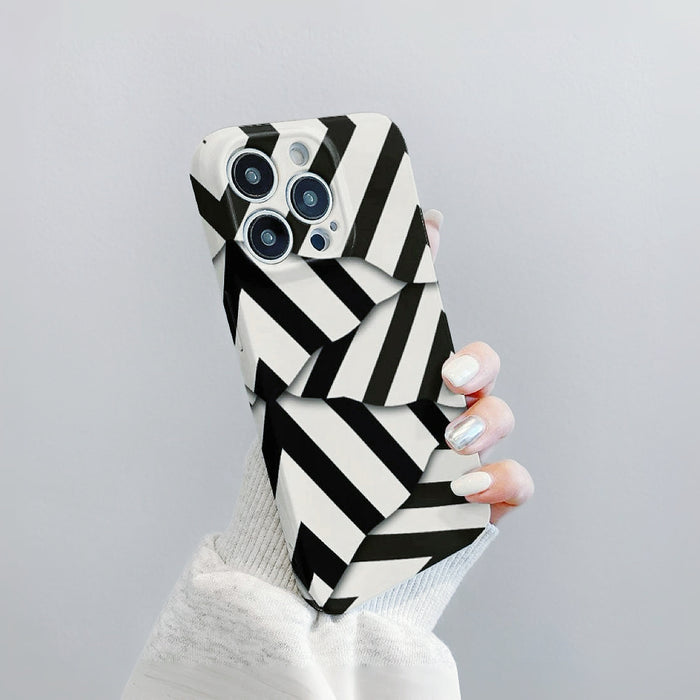 Close-up of Model holding Diagonal Stripe Case. Sleek faux leather and silicone blend with dynamic stripes.