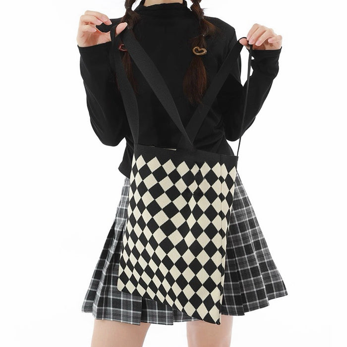 Model carrying a black Diamond Knitted Tote Bag, ideal for city walks and gifting.