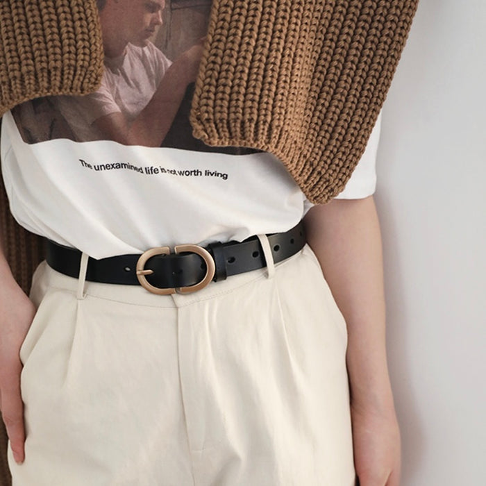 Model wearing black Double C Lady's Belt for minimalist style.