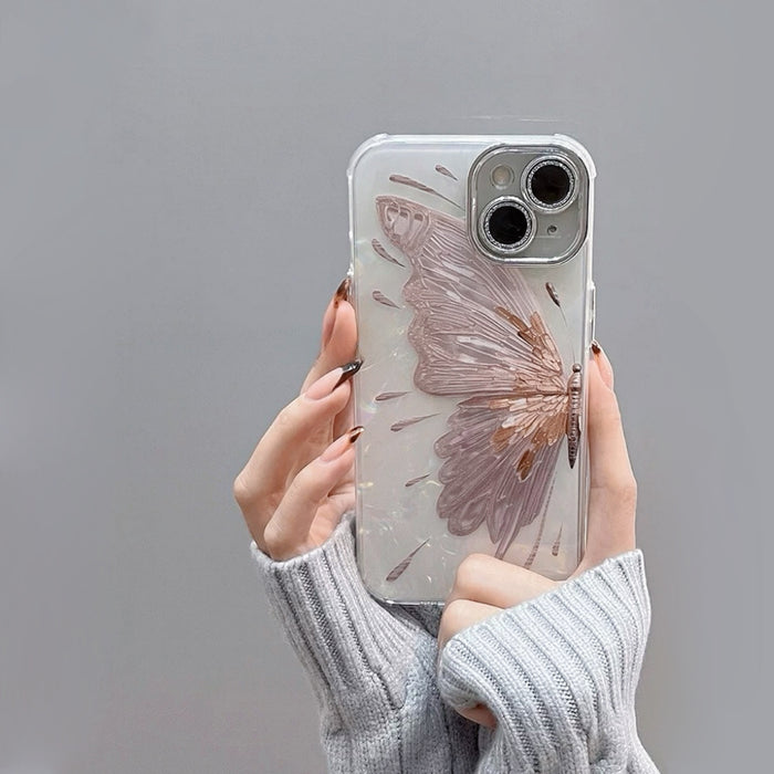 Handheld view of the Dreamy Butterfly Case, shimmering mother of pearl finish with sparkling diamond camera rings.