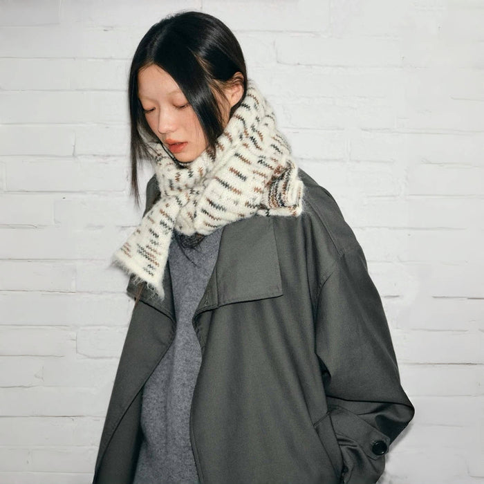 Model wearing soft wool blend scarf with a white, brown, and black aurora texture pattern in gray, great for office.