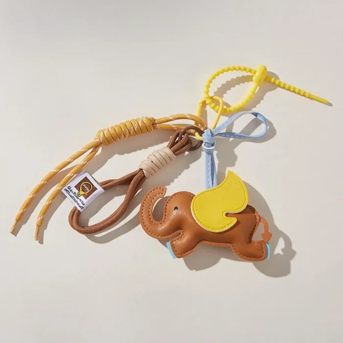 Flat lay of Dumbo Bag Charm, easy to attach to bags and phones.