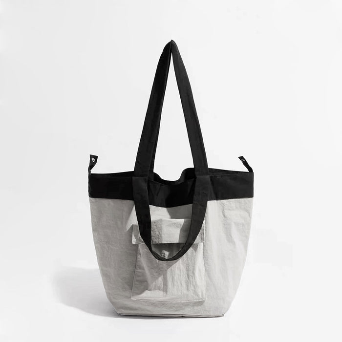 Folded view of Duotone Foldable Tote Bag in gray, easy for commuting and weekends.