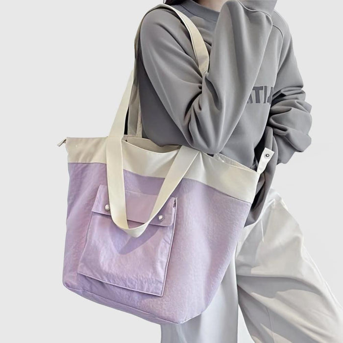 Model carrying a Duotone Foldable Tote Bag in puple, ideal for errands and gifting.