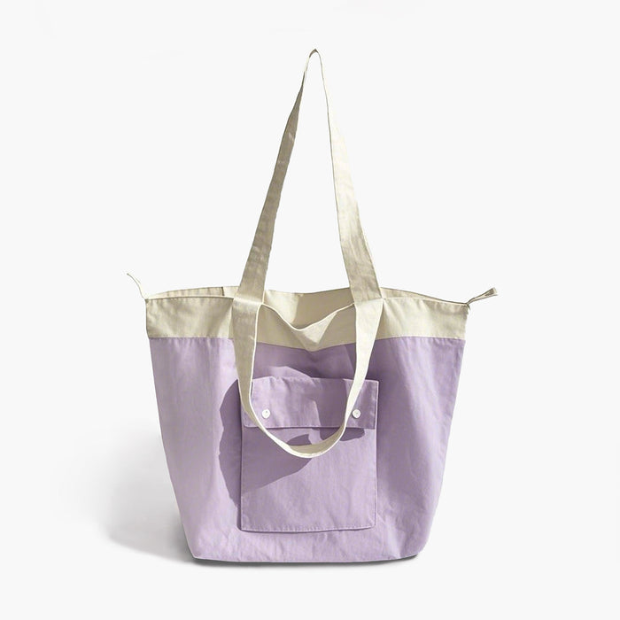 Folded view of Duotone Foldable Tote Bag in puple, great for everyday carry and travel.