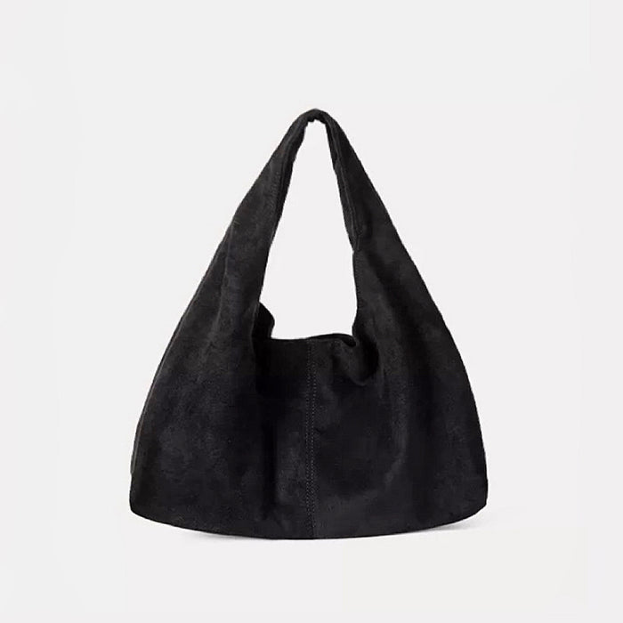 Essential black ease suede hobo bag showcasing its clean and flexible drape.