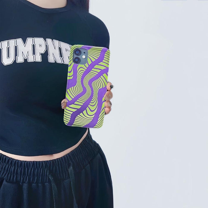 Model holding Electronic Vortex Case. Showcasing futuristic neon pattern for edgy modern street fashion.