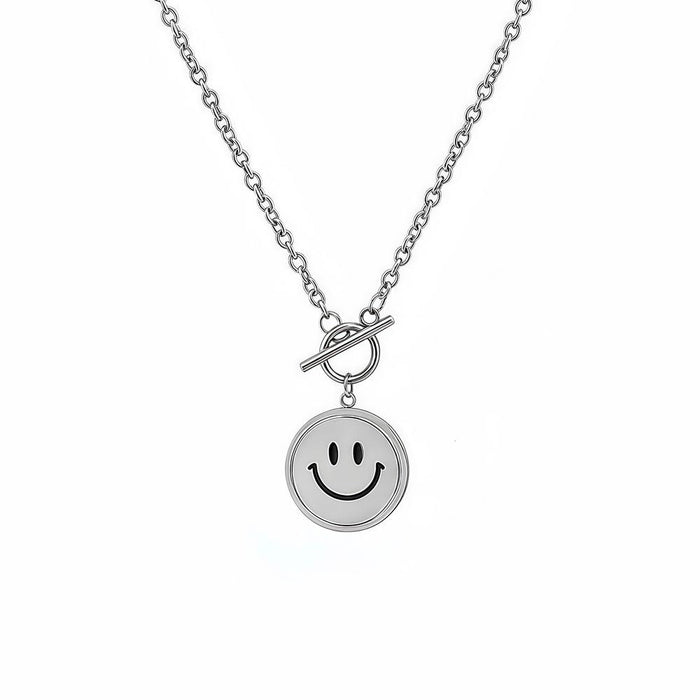 Front view of silver emoti spin necklace showing the toggle clasp and smiley pendant