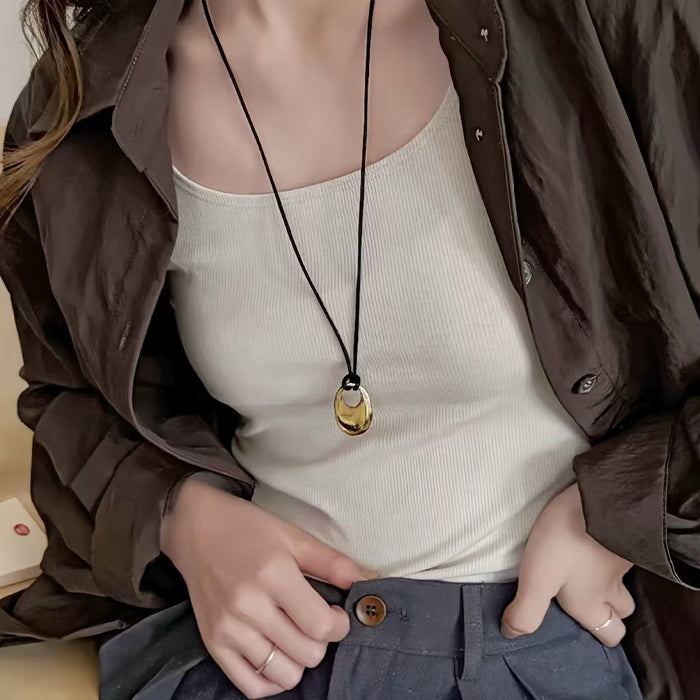 Model wearing a gold necklace, great for parties, weddings, and dates.