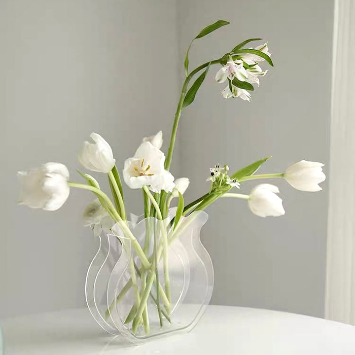 Front view of Clear acrylic fishtail flower vase, with white flowers inside, great for home decor and gifting.