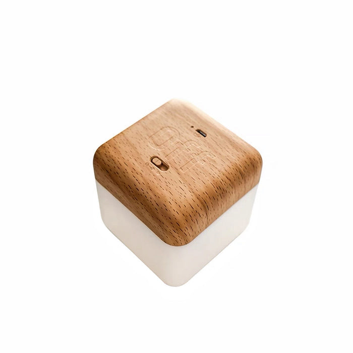Beech wood cubic timer lamp with OFF face up, showing its simple, creative design and light-diffusing base.