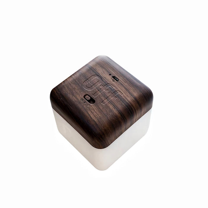Flipping Cubic Timer Lamp with dark walnut wood top and frosted white base, showing OFF face up.