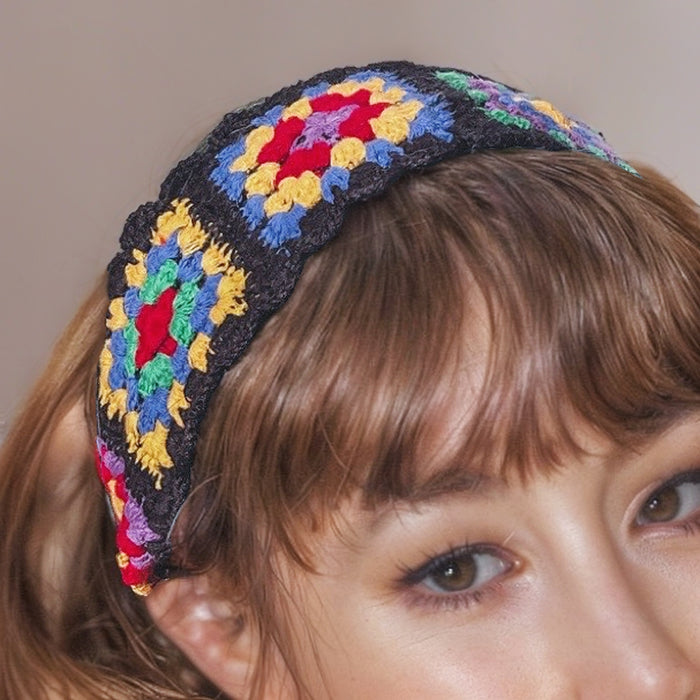 Model wearing a handmade Floral Crochet Hairband with black trim, ideal for quick updos and ponytails.