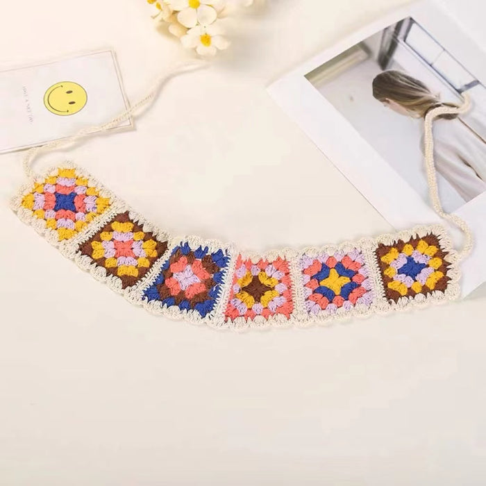 Folded view of Floral Crochet Hairband with white trim , ideal for quick updos and ponytails.