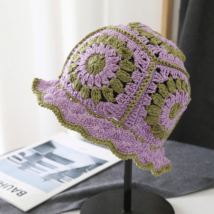 Front view of purple Floral Crochet Hat. Vibrant artistic patterns on a skin-friendly knitted frame.