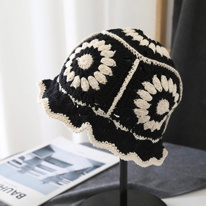 Front view of black Floral Crochet Hat. Versatile dark tone with detailed handcrafted crochet textures.