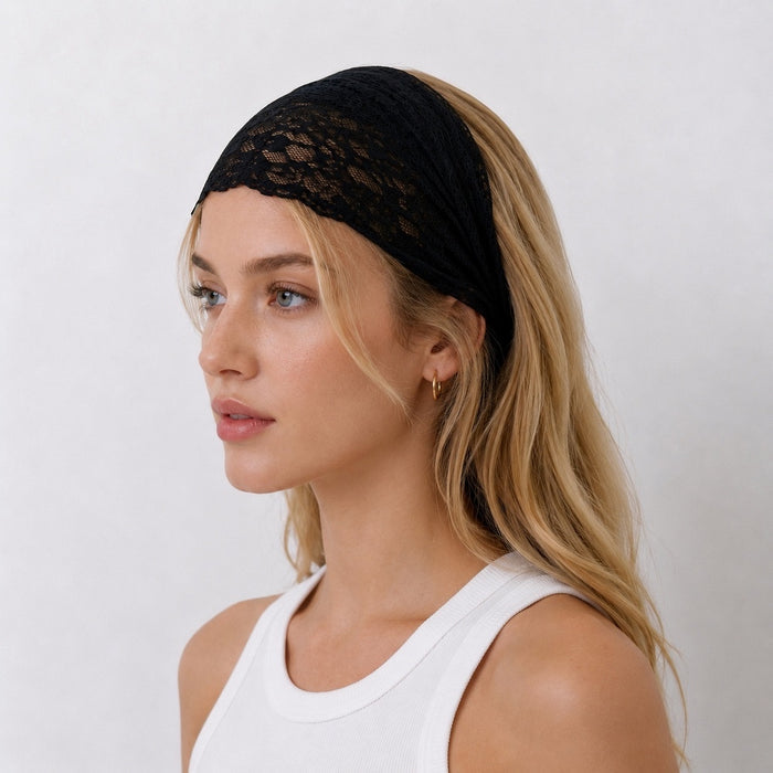 Side view of a model wearing the black lace headband folded narrower for a subtle gothic hair accessory look.