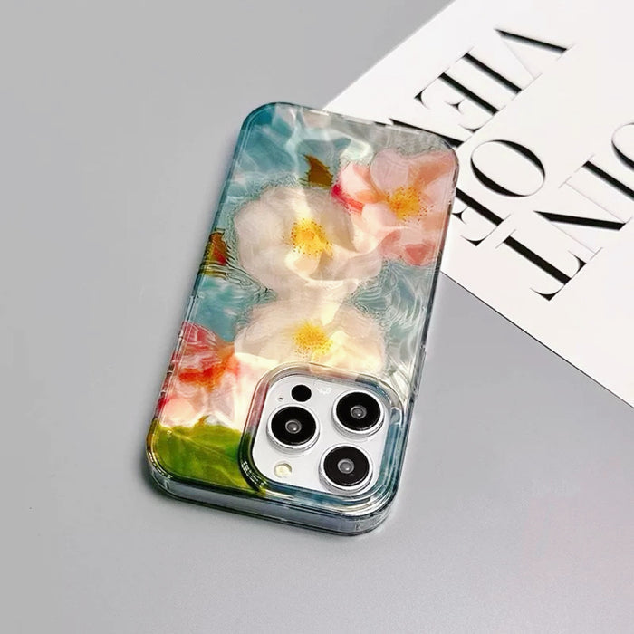 White and pink flowers floating on blue-green water design silicone case. Submerged botanical art.