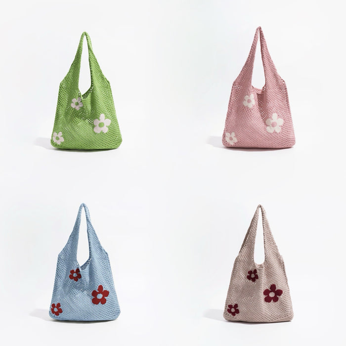 Front view of Four crochet shoulder bags in green, pink, blue, and khaki, each with white or red flower appliques.