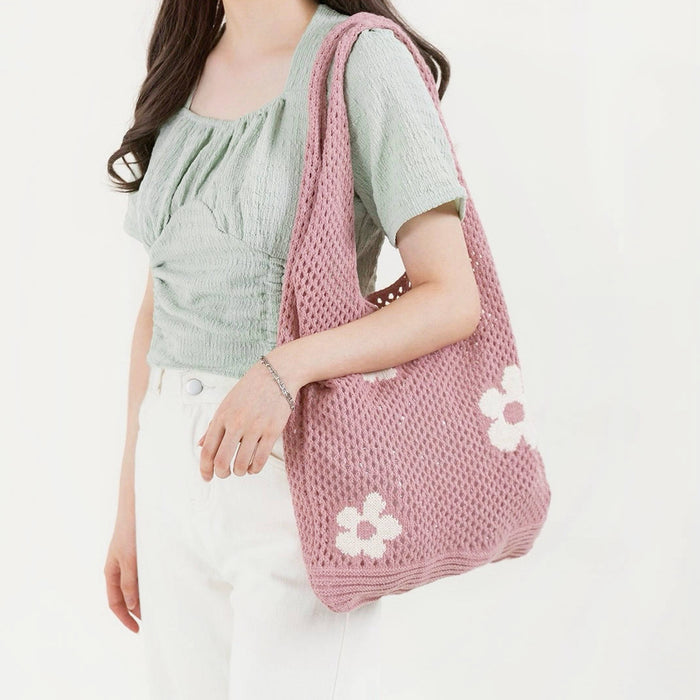 Model carrying a pink Flowers Crochet Shoulder Bag, ideal for city walks and gifting.