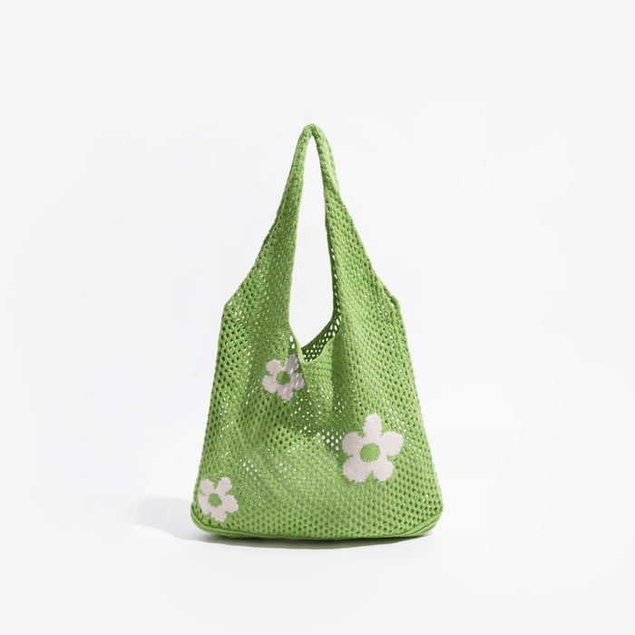 Flat lay of Flowers Crochet Shoulder Bag in green, great for everyday carry and travel.