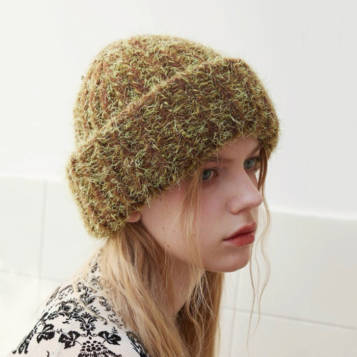 Fluffy knitted thick beanie in brown and lime green, showcasing high-density texture for extreme cold.