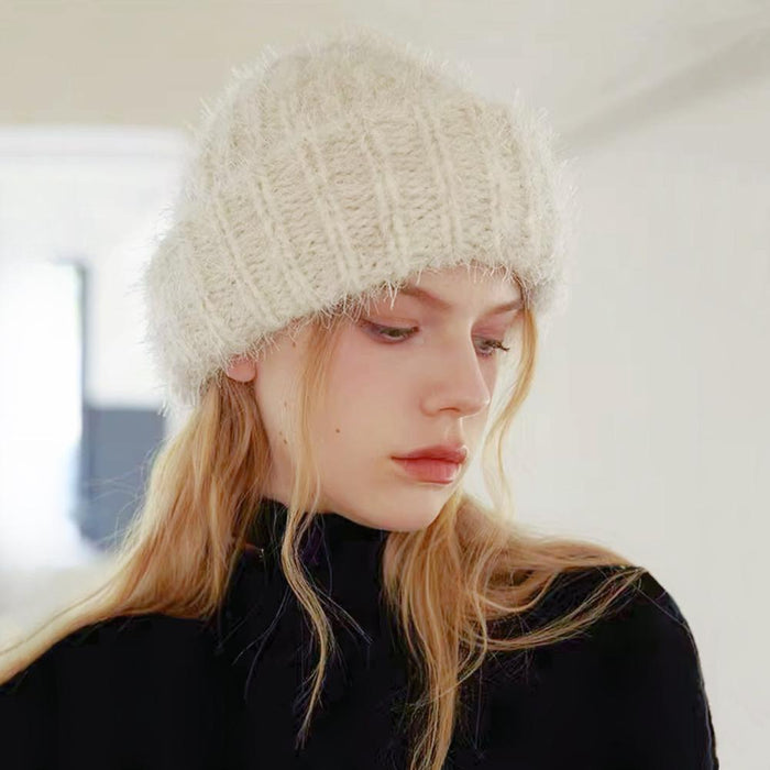 Model wearing white Fluffy Knitted Thick Beanie. Boasts high-density wool-acrylic blend for premium warmth.