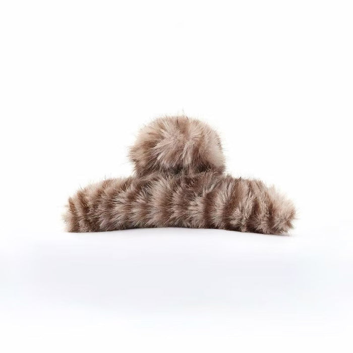 Close-up of Fluffy Striped Hair Claw in brown, easy for workdays and special occasions.