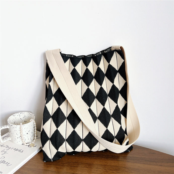 Minimalist black and beige argyle knitted tote bag featuring an open-top design.