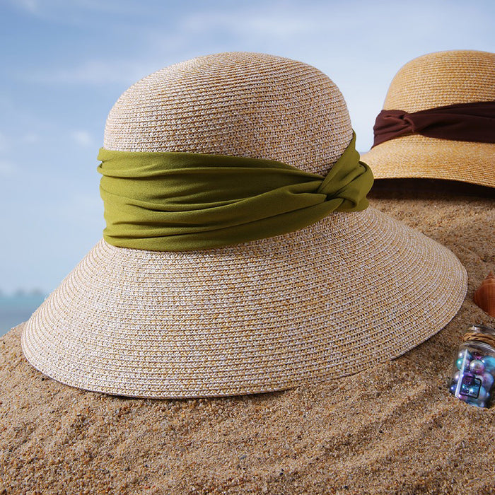Front view of green Ribbon Straw Hat, showcasing fine-woven construction and a sophisticated ribbon tie.