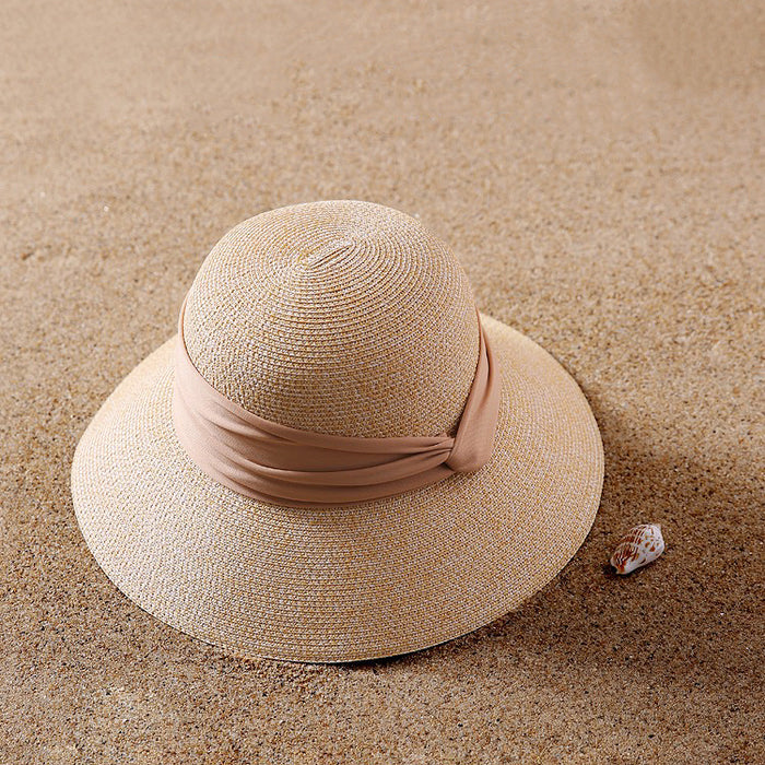 Front view of beige Ribbon Straw Hat. Timeless neutral tone with a premium woven texture and elegant bow.