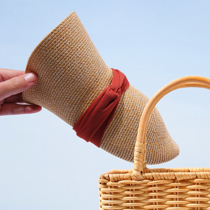 Detailed view of Ribbon Straw Hat. Lightweight, breathable, and foldable design for easy travel storage.