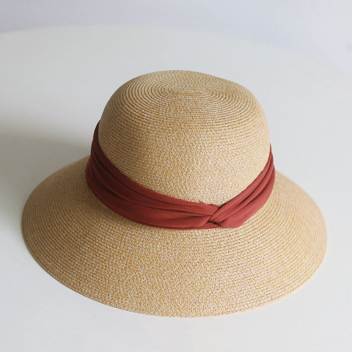 Front view of red Ribbon Straw Hat. High-visibility chic sunhat crafted for beach resorts and outdoor events.