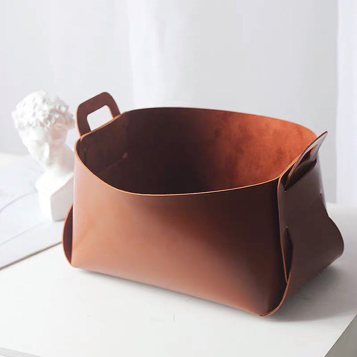 Rich brown PU leather storage basket; warm earth-tone accessory perfect for bedside table or living room storage.