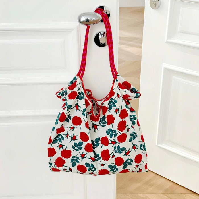 Flat lay of Tote Bag with rose pattern, great for everyday carry and travel.
