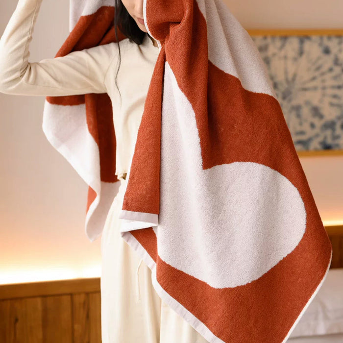 Close-up of Full Of Love bath Towel with heart pattern, showcasing the cotton fabric and heart detail.