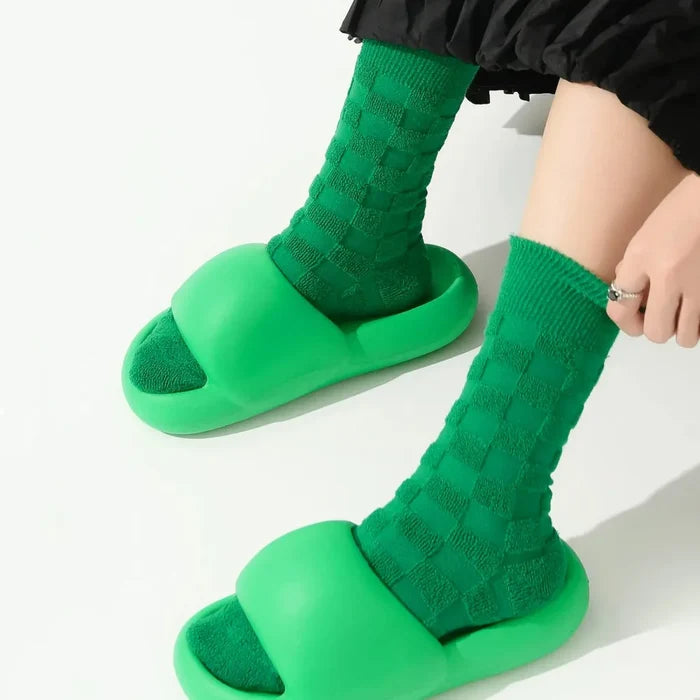 Model wearing a pair of Fuzzy Check Textured Socks in green, great for casual wear and light workouts.