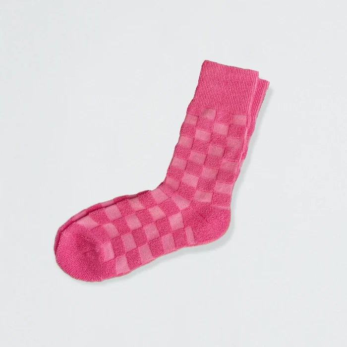 Close-up of Fuzzy Check Textured Socks in pink, easy to pack for travel and errands.