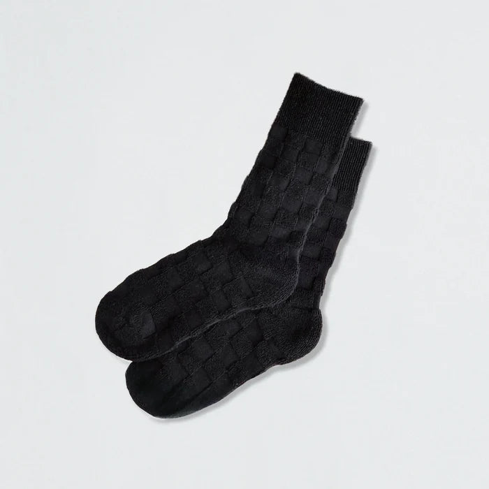 Close-up of Fuzzy Check Textured Socks in black, great for daily wear and lounging.