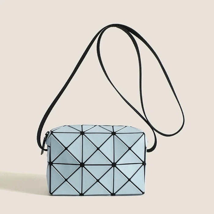 Front view of Light blue GeoChic crossbody bag with geometric PU leather design and black adjustable strap,.