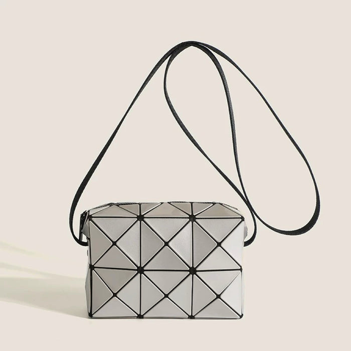 Angled view of GeoChic Crossbody Bag in gray, great for everyday carry and travel.
