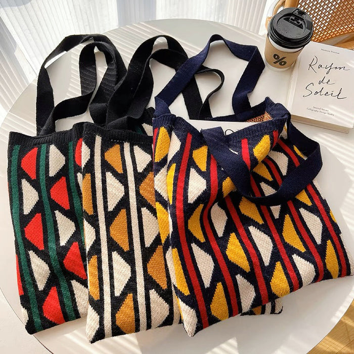 Front view of Three  knitted tote bags with geometric contrast color patterns .