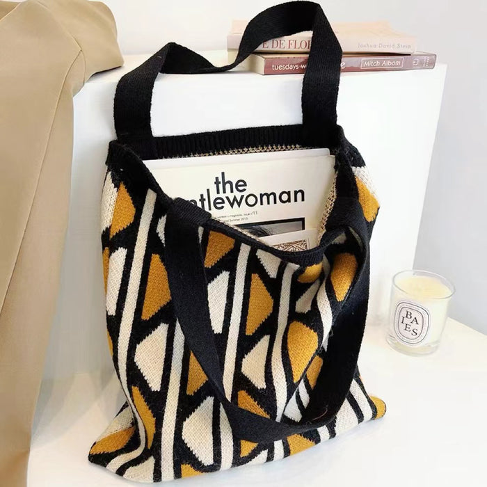 Flat lay of Geometric Contrast Color Knitted Tote Bag in black and yellow, great for everyday carry and travel.