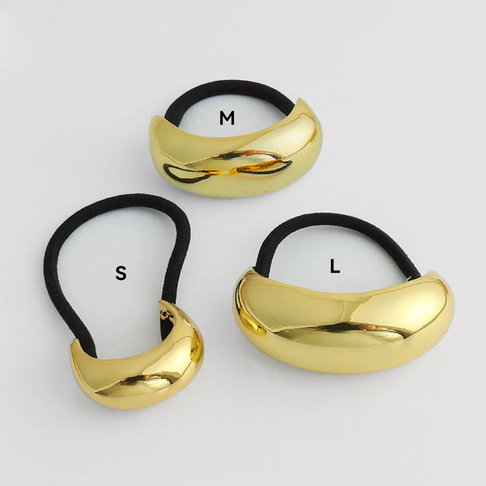 Angled view of  gold Gleaming Curve Hair Cuff in different sizes , ideal for quick updos and ponytails.