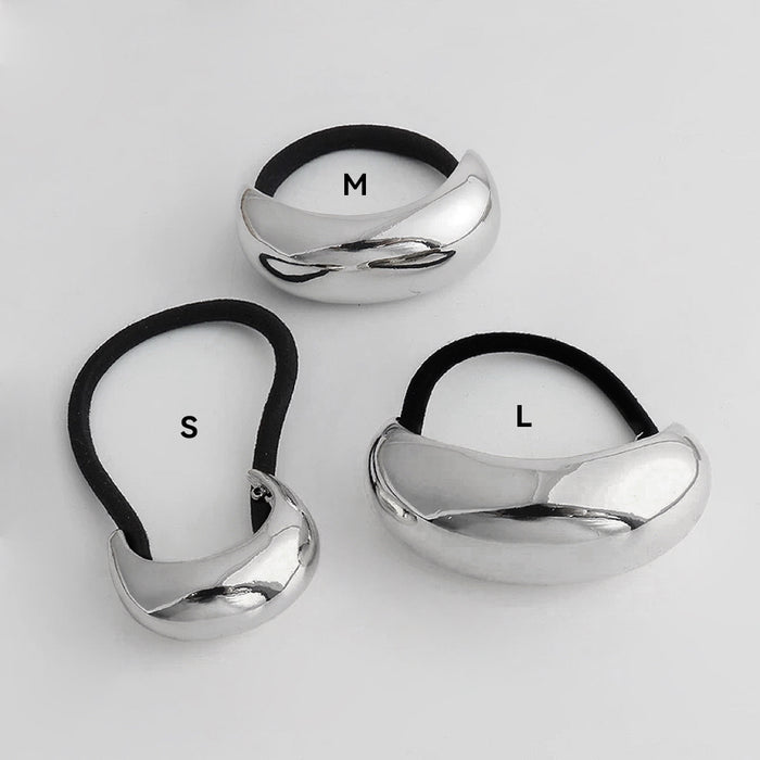 Front view of three silver Gleaming Curve Hair Cuff hair accessory in different sizes.